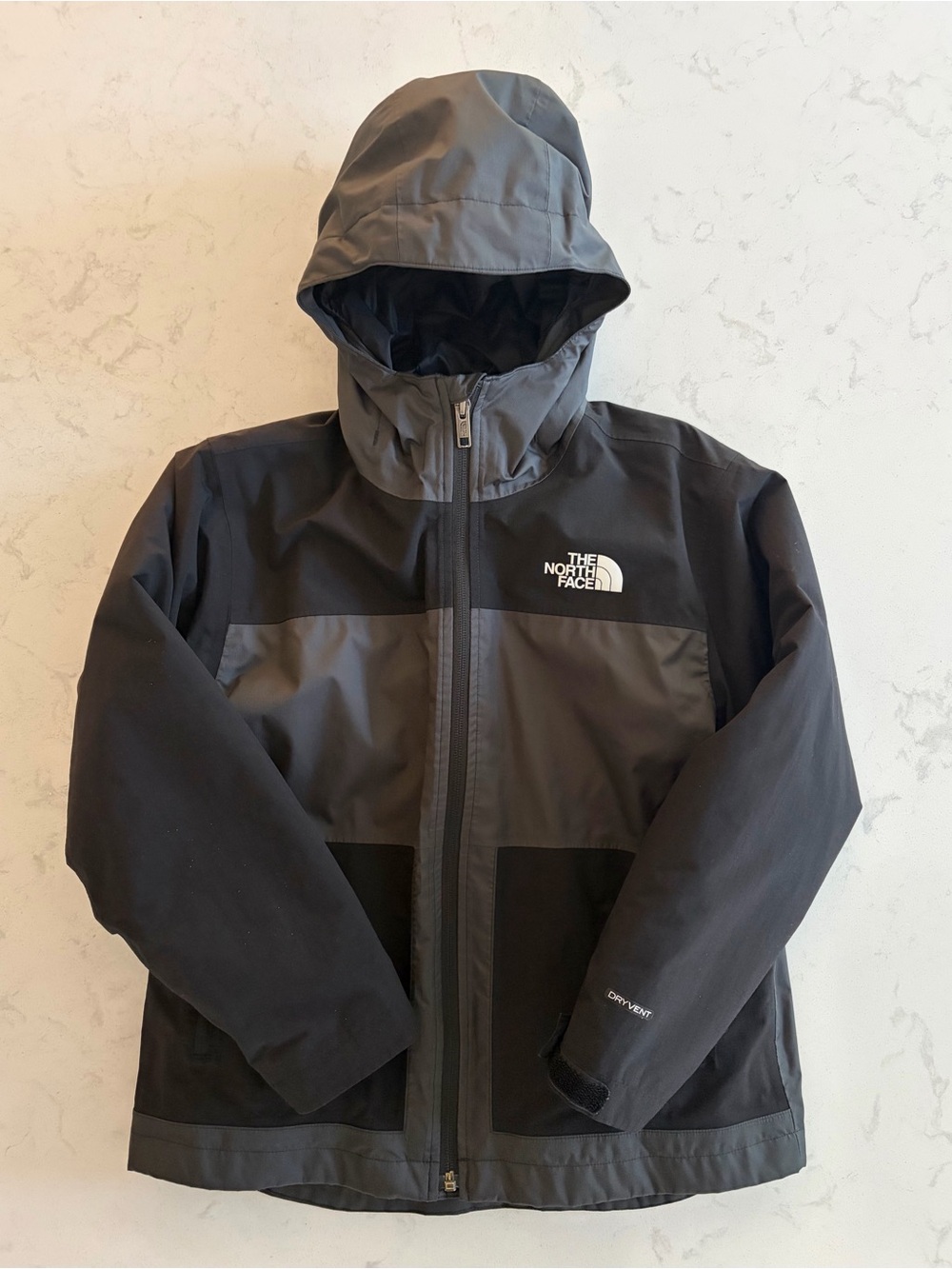 The North Face Boys Hooded Waterproof Winter Jacket with removable inner.